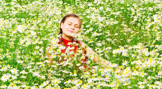 woman-joyful-flower-field