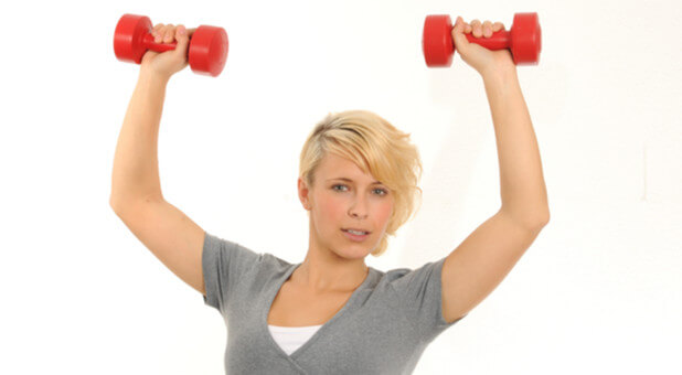 woman holding dumbbells