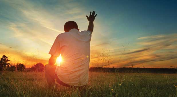 Praying in a field