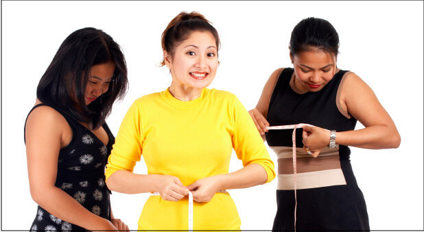 three woman measuring themselves