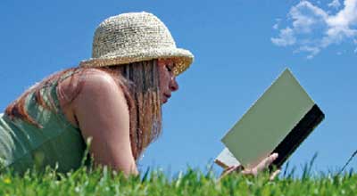 woman reading book outside