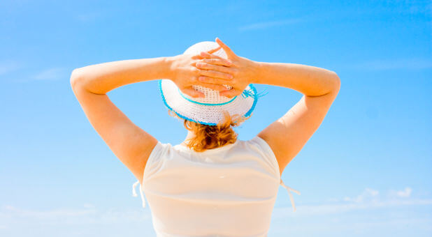 woman-relaxing-blue-sky