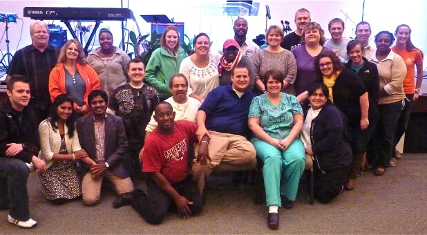 Jason and Chloe Cook (center) with the leadership team of The Refuge