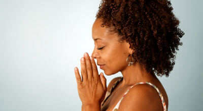 black woman praying