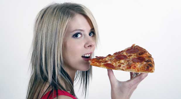 Girl eating pizza