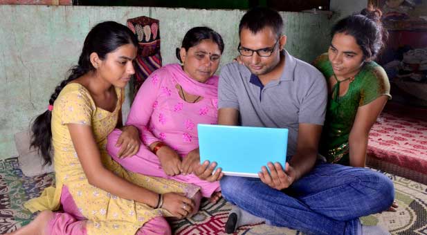 family in India on laptop