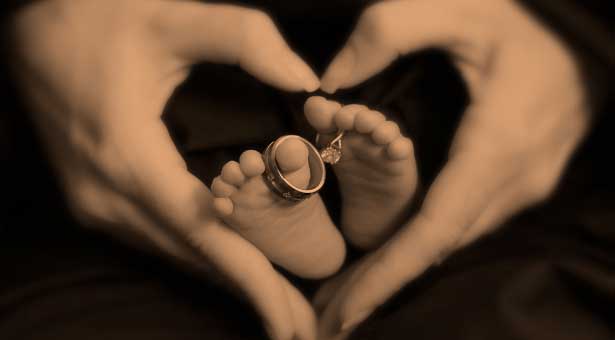 Heart surrounding baby feet