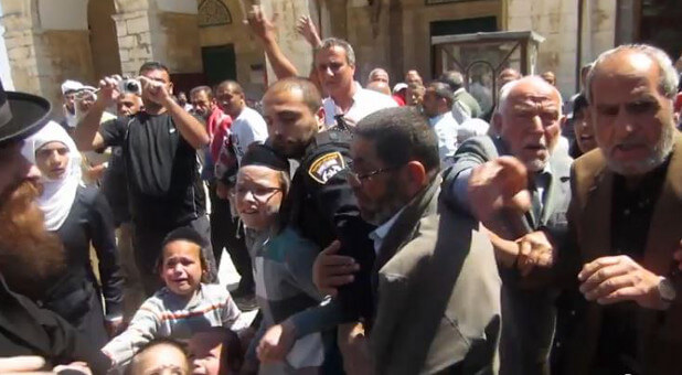 Israeli police attempt to protect Jews from angry Arabs in an incident recently at the Temple Mount in Jerusalem.