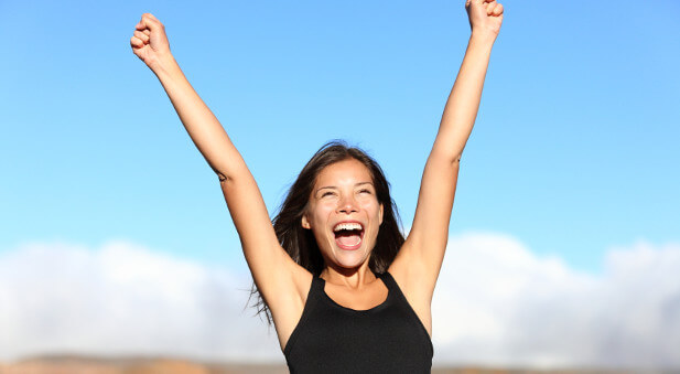 woman holding hands up