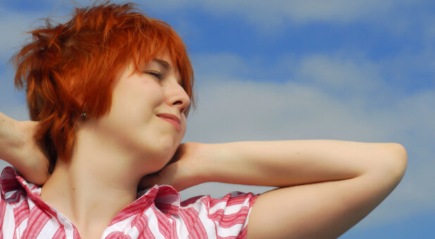 woman with sky behind her