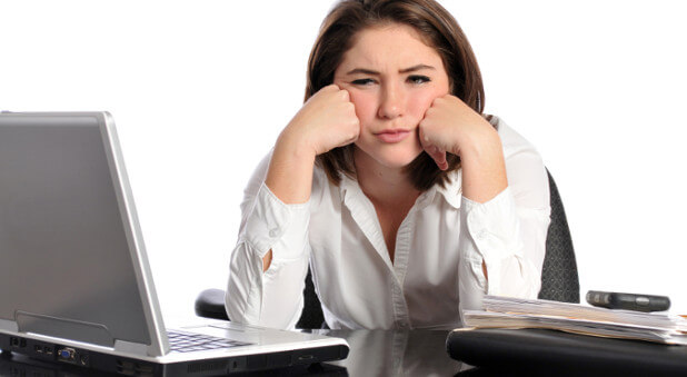 woman frustrated sitting in front of computer