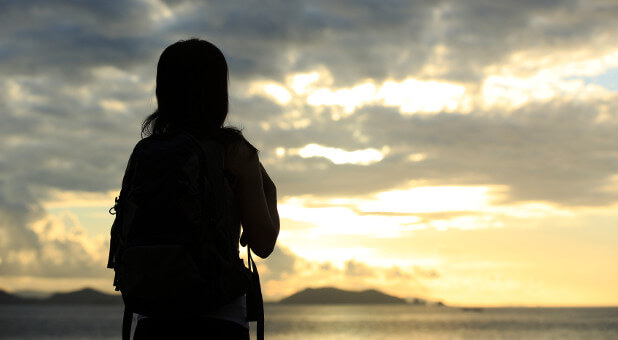 woman watching sunrise