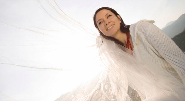 woman smiling behind a veil