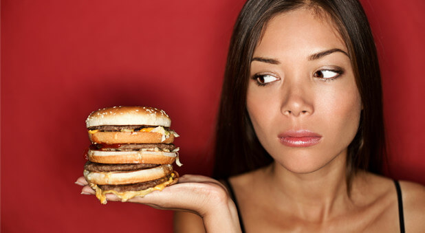 woman eating hamburger