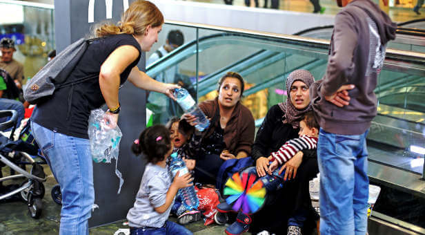 Members of the Mahabba Network minister to Muslims at an airport.