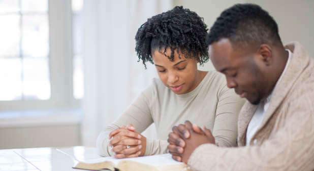 Husband and wife praying