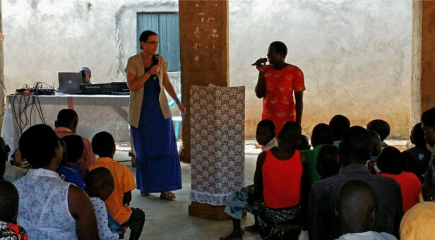 Karen preaches at a church in Uganda.