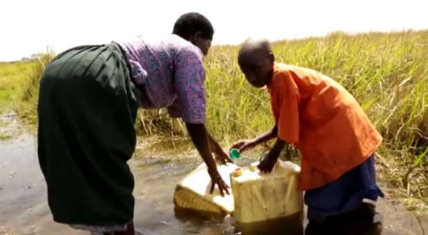 Many people worldwide, including this family in Uganda, do not have clean water to drink.